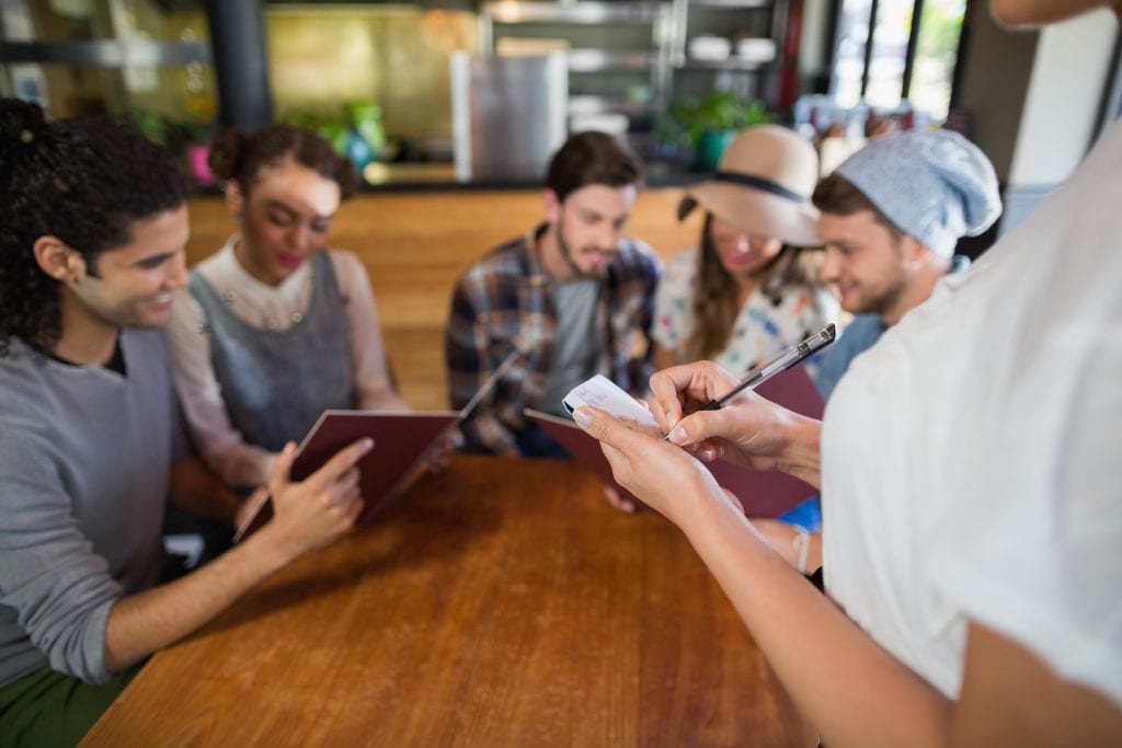 A Complete Guide for Kids-Friendly Restaurants in UK 3 waitress taking orders of customers in restaurant J2UWGCS